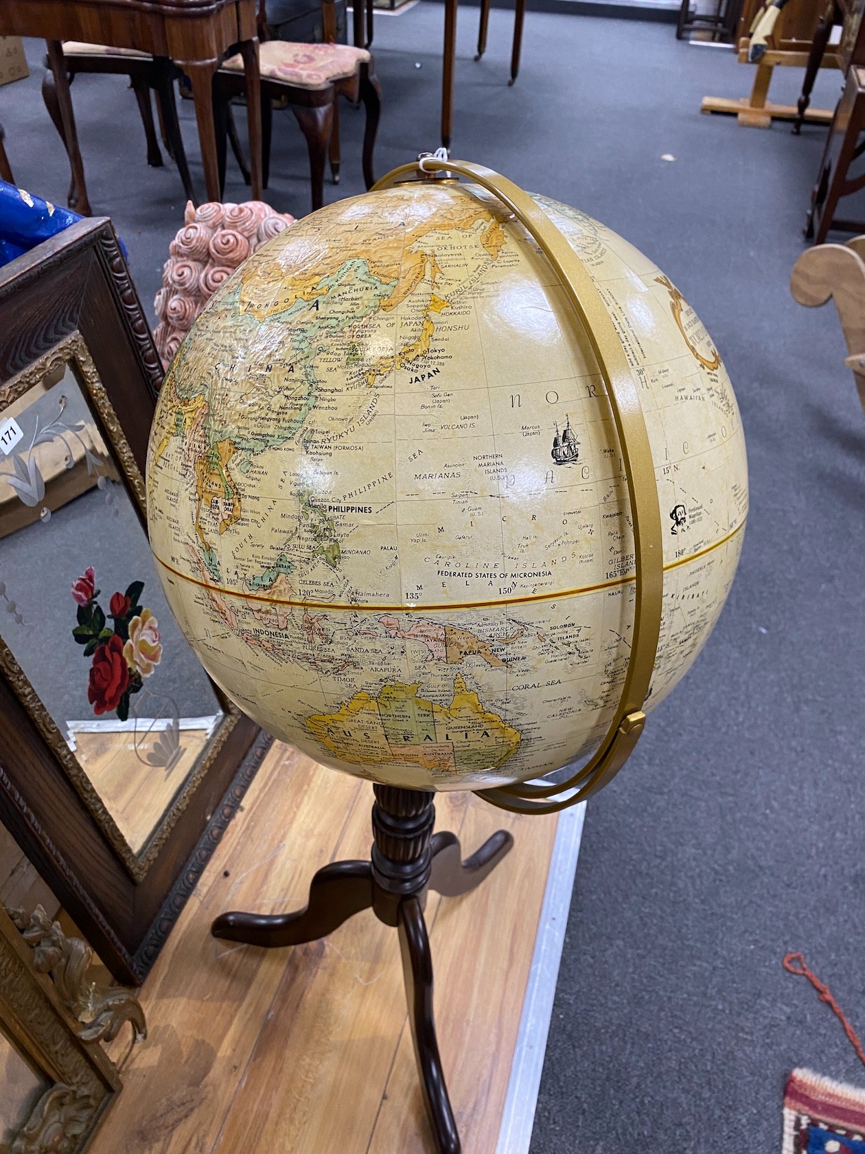 A Replogle 16inch terrestrial globe on tripod stand height 97cm.